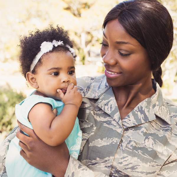 Soldier Mom holding Infant Daughter